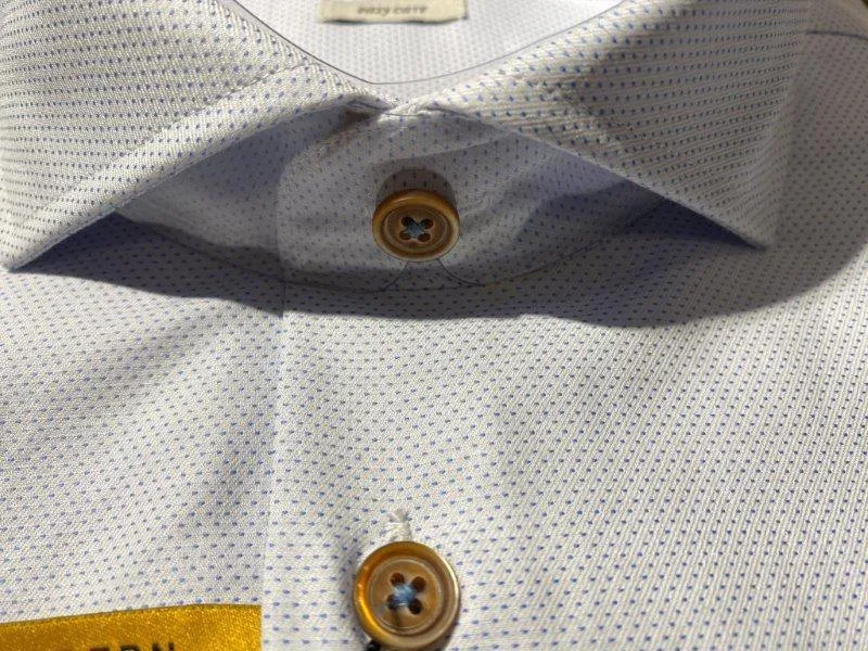 Sure! The optimized title for this e-commerce product in English with modifiers could be: Mens White and Blue Striped Bugatti Polo Shirt - Style 9951 - Size 58503.